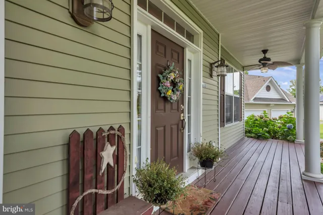 a view of a house with a door and wooden floor