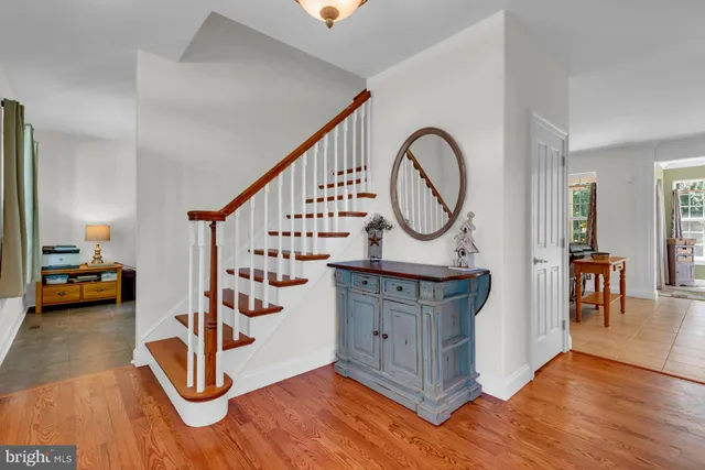 a view of an entryway with wooden floor