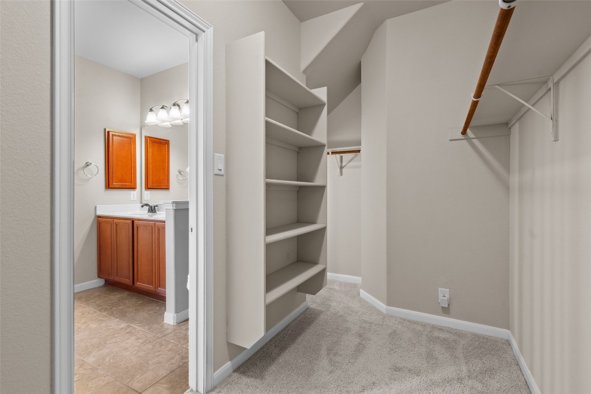 8540 White Ibis Drive Austin, TX 78729 - Photo 15 of 39 a view of an empty room and a bathroom