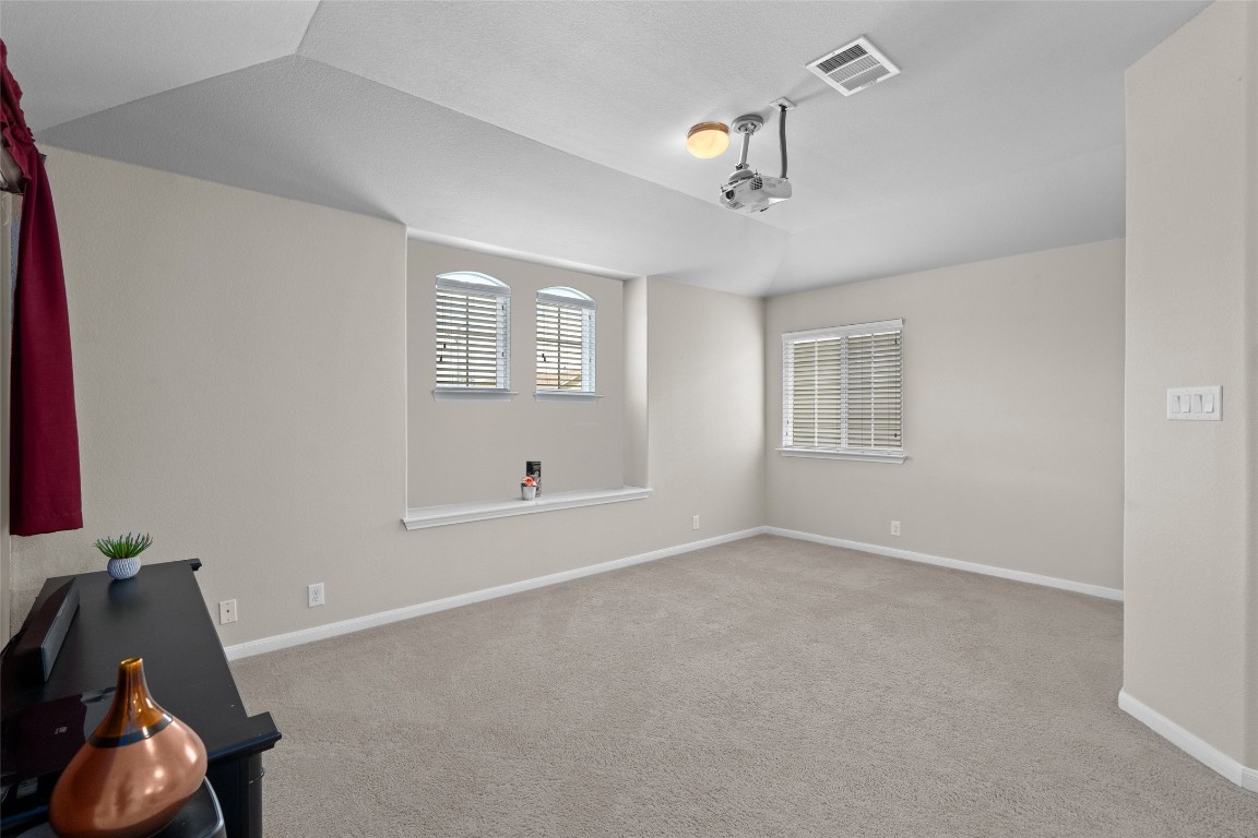 8540 White Ibis Drive Austin, TX 78729 - Photo 17 of 39 a view of an empty room with a window