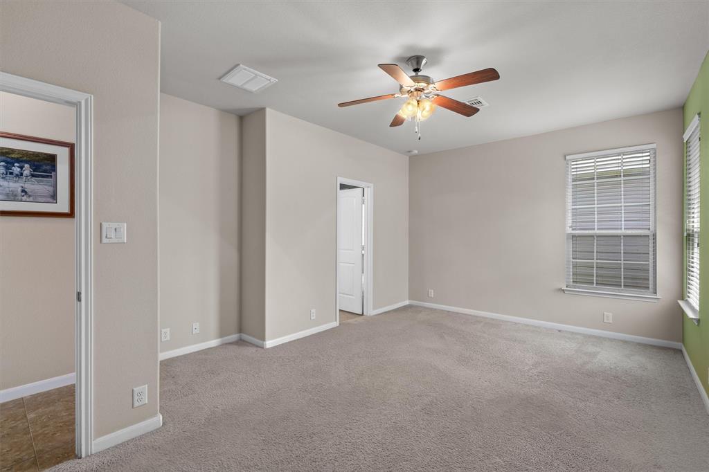 8540 White Ibis Drive Austin, TX 78729 - Photo 20 of 39 a view of an empty room with a window