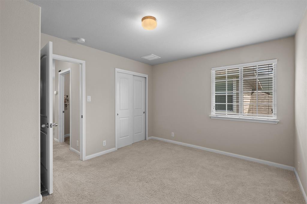 8540 White Ibis Drive Austin, TX 78729 - Photo 21 of 39 an empty room with windows