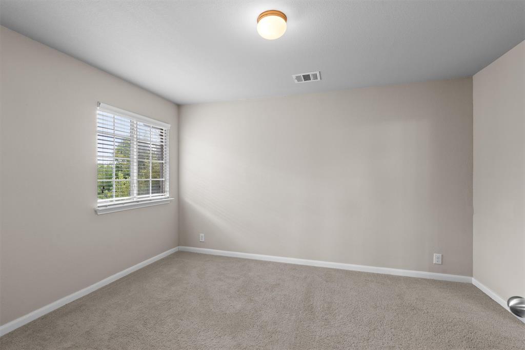 8540 White Ibis Drive Austin, TX 78729 - Photo 22 of 39 an empty room with a window