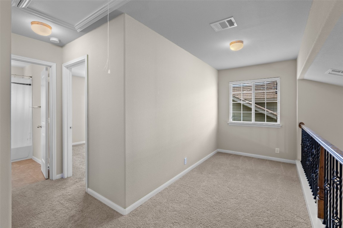 8540 White Ibis Drive Austin, TX 78729 - Photo 25 of 39 an empty room with windows