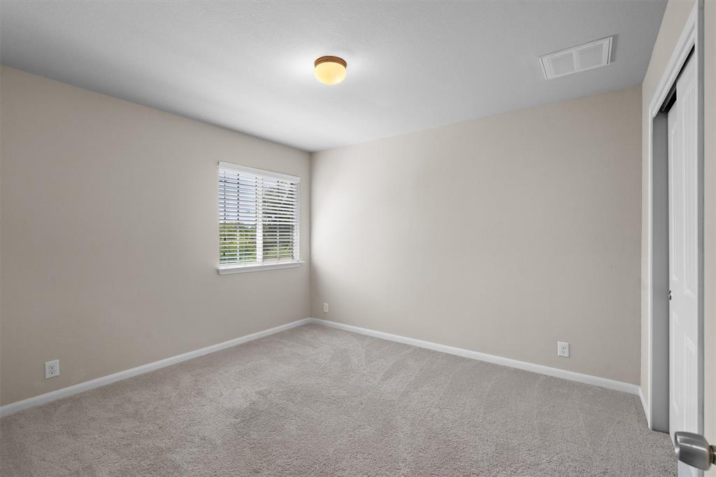 8540 White Ibis Drive Austin, TX 78729 - Photo 26 of 39 an empty room with a window