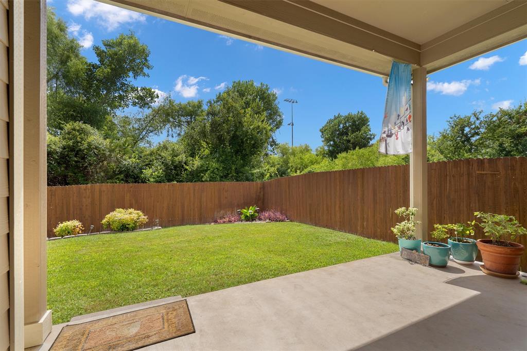 8540 White Ibis Drive Austin, TX 78729 - Photo 28 of 39 a view of a backyard with a sitting area
