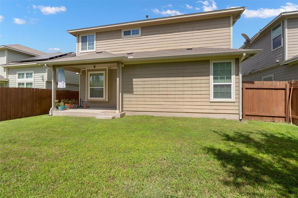 8540 White Ibis Drive Austin, TX 78729 - Photo 29 of 39 a view of a house with garden