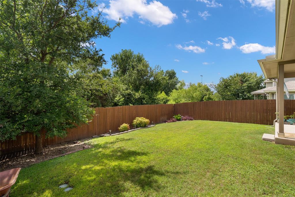 8540 White Ibis Drive Austin, TX 78729 - Photo 30 of 39 a view of backyard with green space