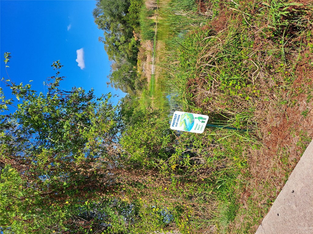8540 White Ibis Drive Austin, TX 78729 - Photo 32 of 39 a view of a back yard from a garden