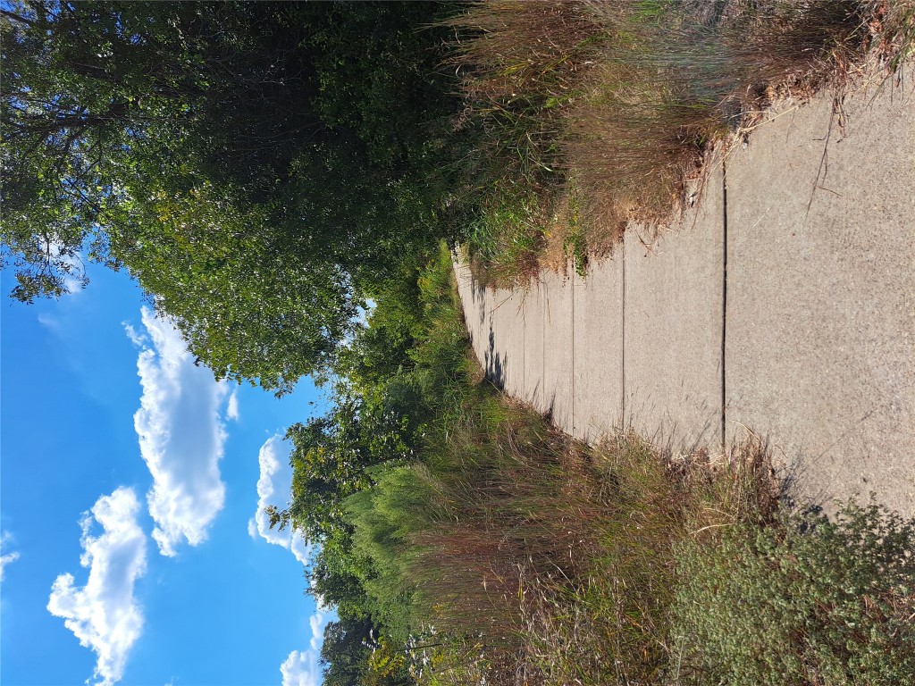8540 White Ibis Drive Austin, TX 78729 - Photo 35 of 39 a view of a pathway with a yard