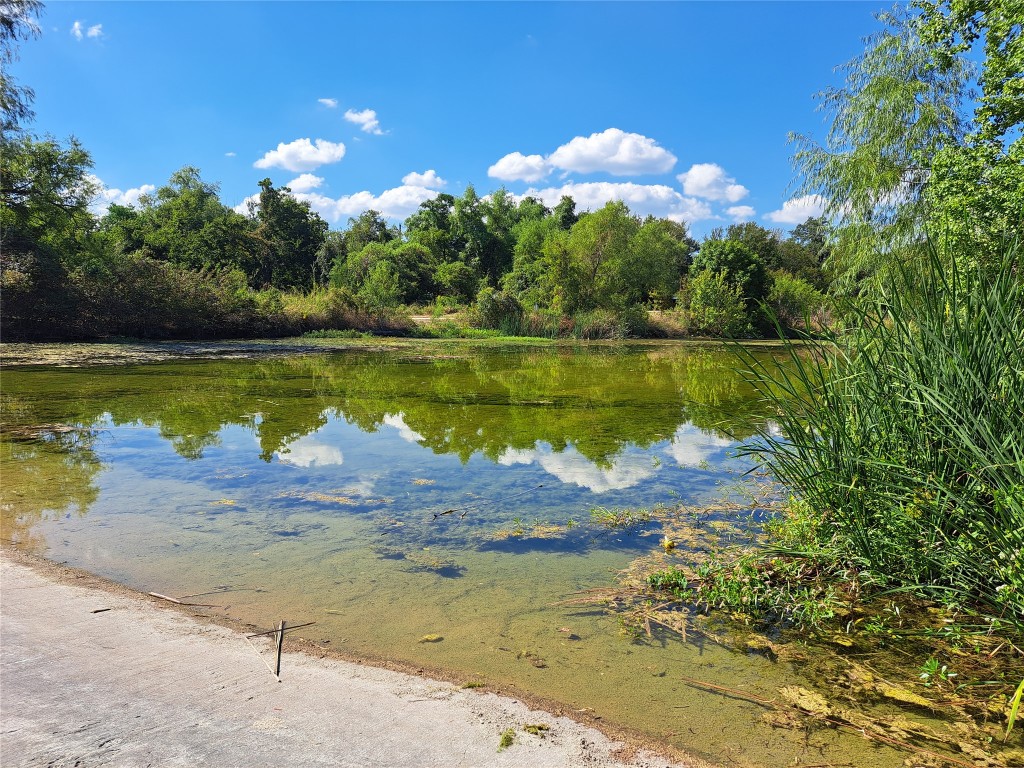 8540 White Ibis Drive Austin, TX 78729 - Photo 37 of 39 a view of a lake with a lake
