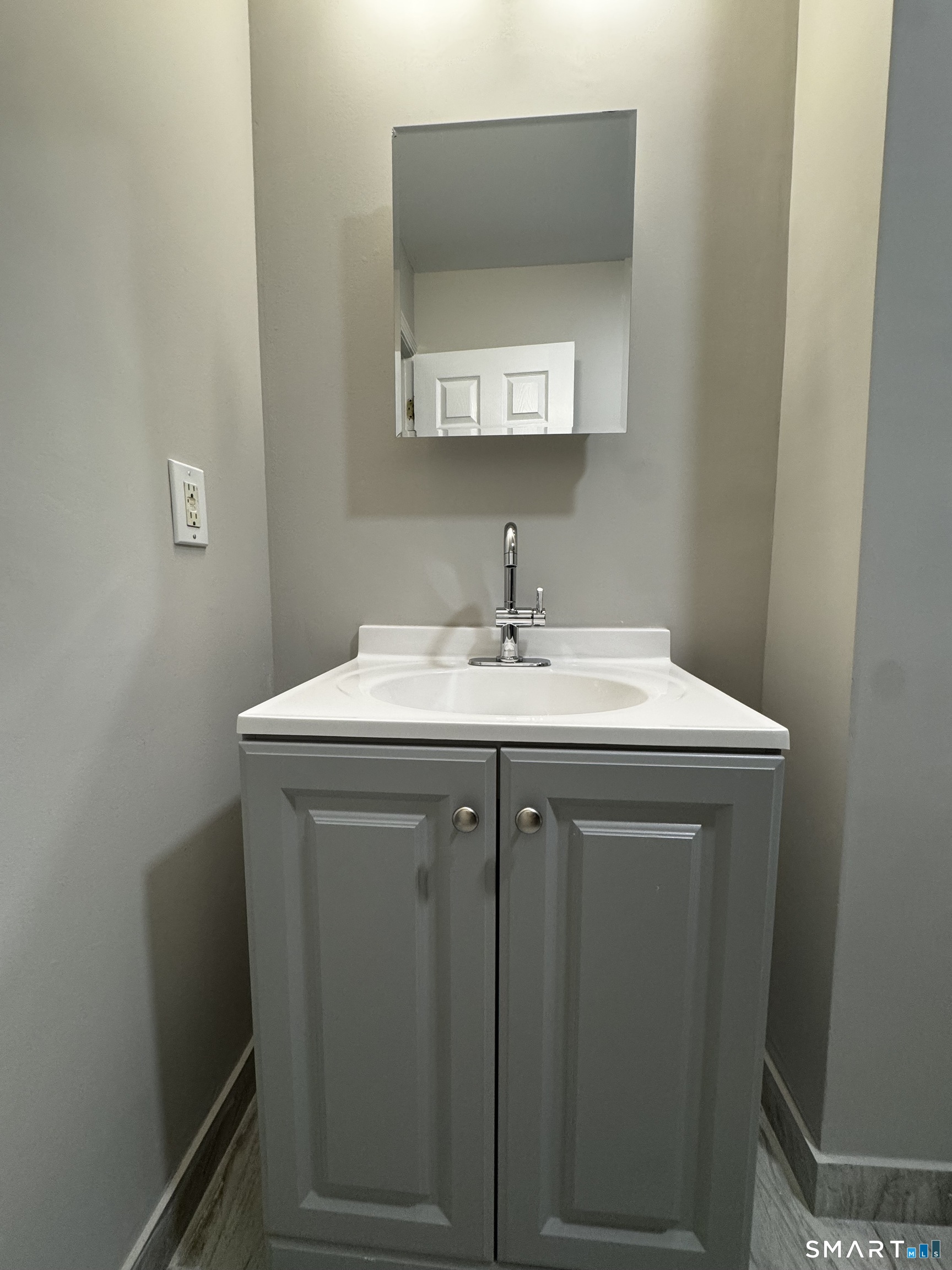 45-51 Cowles Street, Unit 45 Bridgeport, CT 06607 - Photo 17 of 33 completely renovated bathroom with new vanity, new medicine cabinet, new standup shower with frameless sliding glass door, new tile floor, new lighting and paint