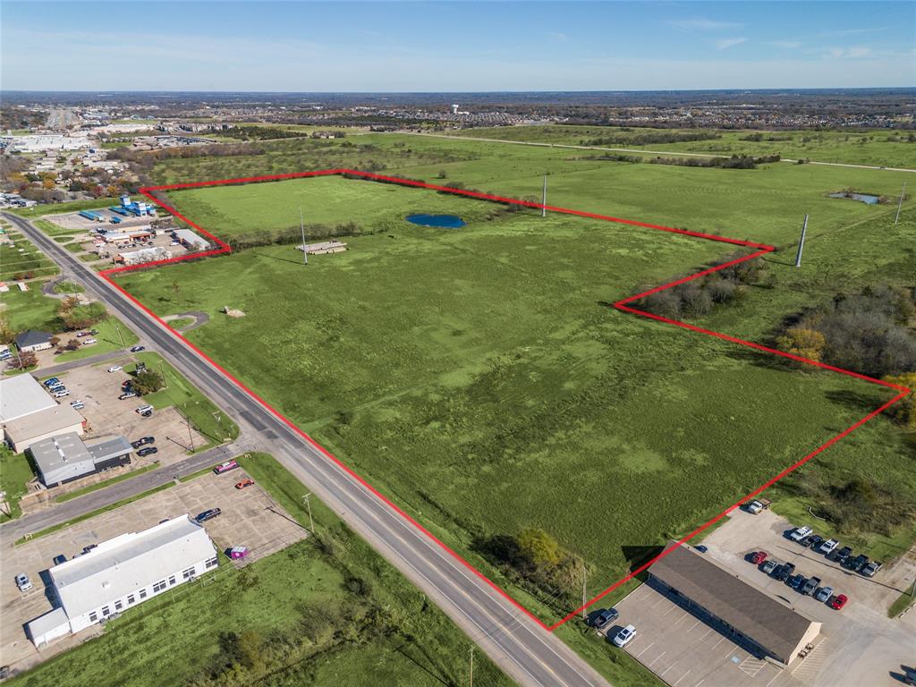 8903 Wesley Street Greenville, TX 75402 - Photo 2 of 15 a view of a city from a balcony