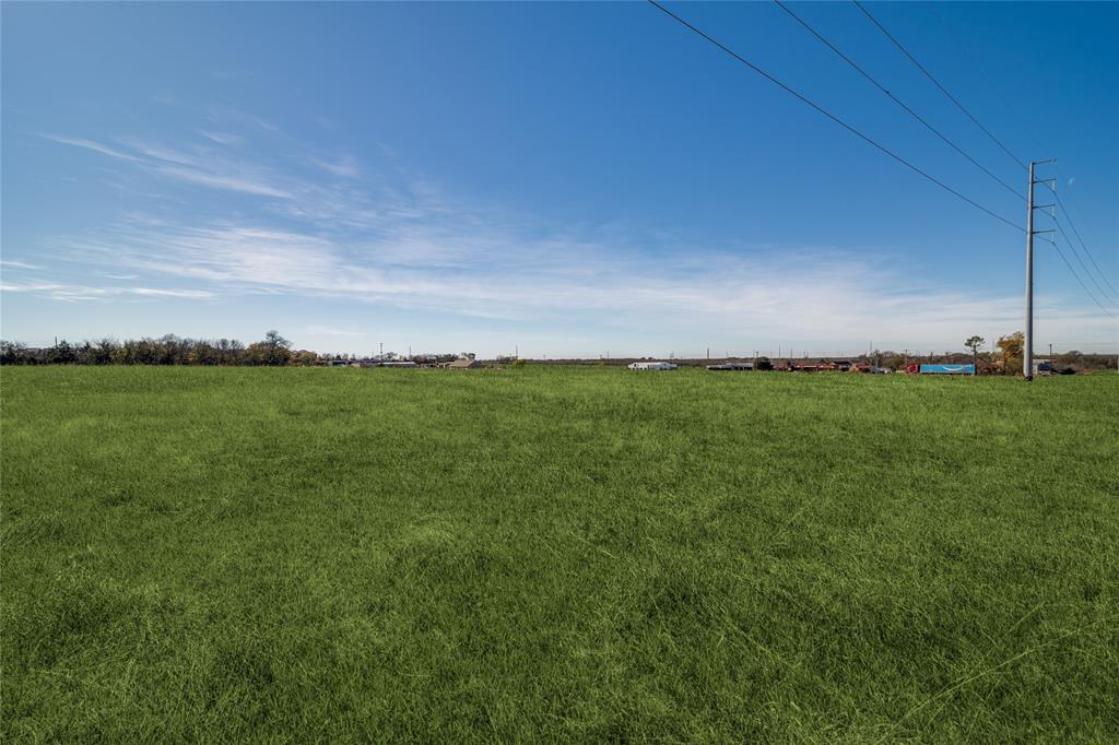 8903 Wesley Street Greenville, TX 75402 - Photo 7 of 15 a view of a field with an ocean