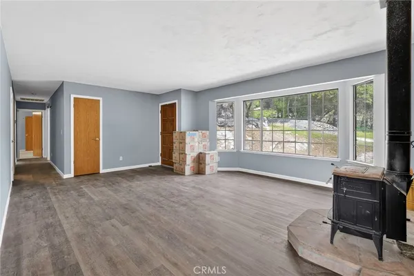a view of a livingroom with furniture and a window