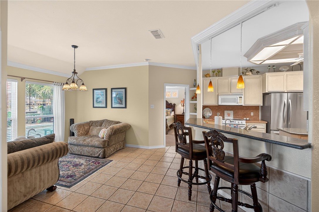 15969 Punta Espada Loop Corpus Christi, TX 78418 - Photo 8 of 40 Dining or sitting area. Kitchen breakfast bar.