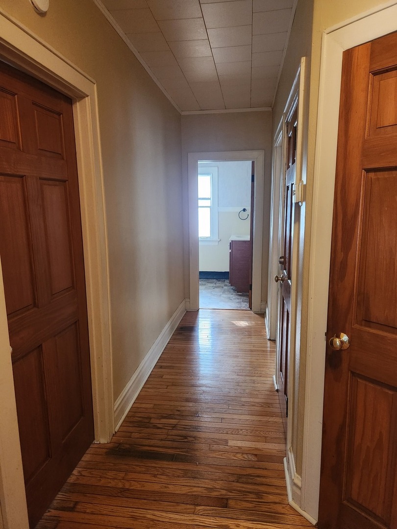 1125 Paul Street Ottawa, IL 61350 - Photo 25 of 29 a view of a hallway with wooden floor