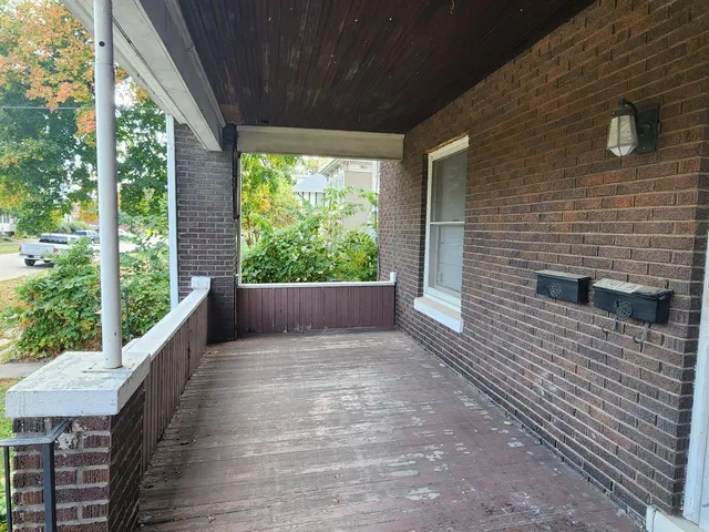 a view of balcony with furniture