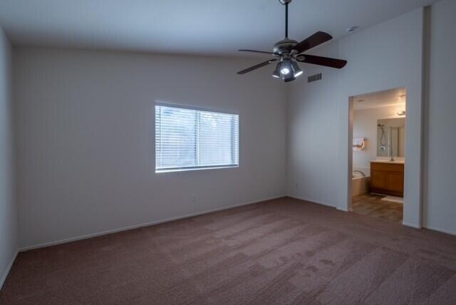 48396 Agua Caliente Street Coachella, CA 92236 - Photo 12 of 14 a view of a livingroom with a ceiling fan and window