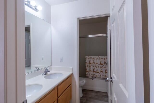 48396 Agua Caliente Street Coachella, CA 92236 - Photo 8 of 14 a bathroom with a granite countertop sink a toilet and shower