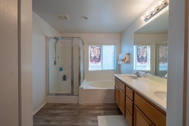 48396 Agua Caliente Street Coachella, CA 92236 - Photo 10 of 14 a bathroom with a granite countertop sink a mirror a bathtub and shower