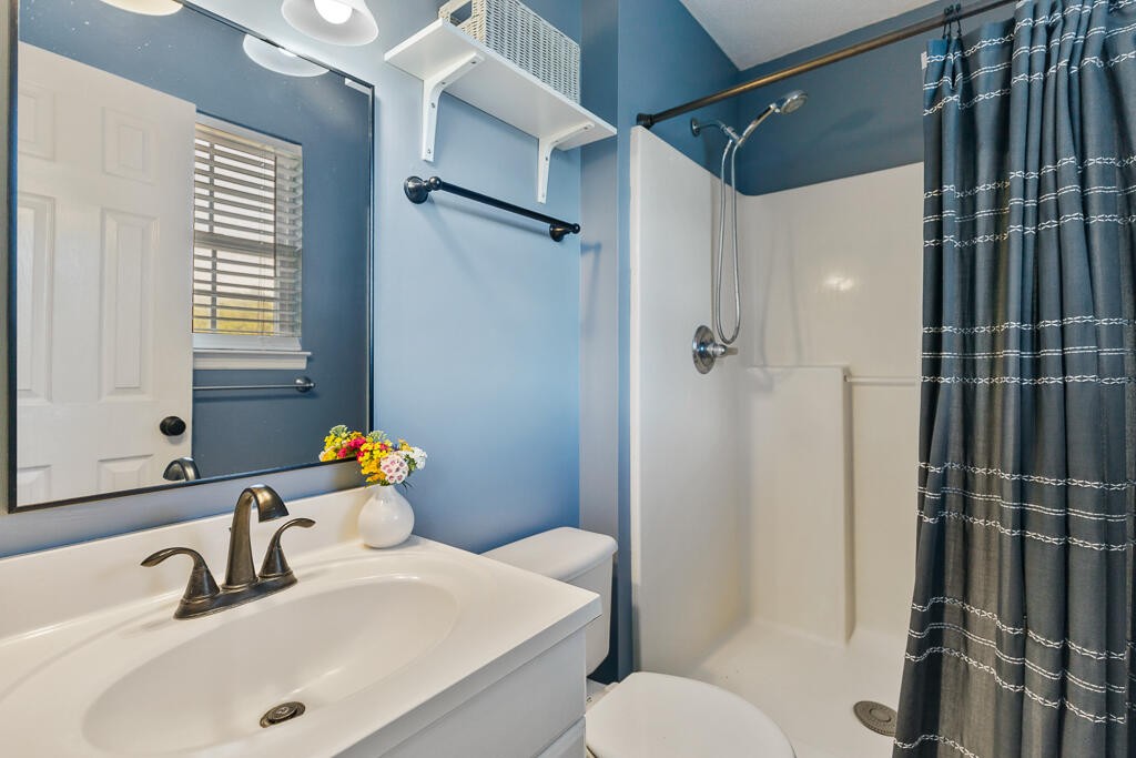 2850 Lower River Road Northwest Georgetown, TN 37336 - Photo 23 of 38 a bathroom with a sink mirror toilet and shower