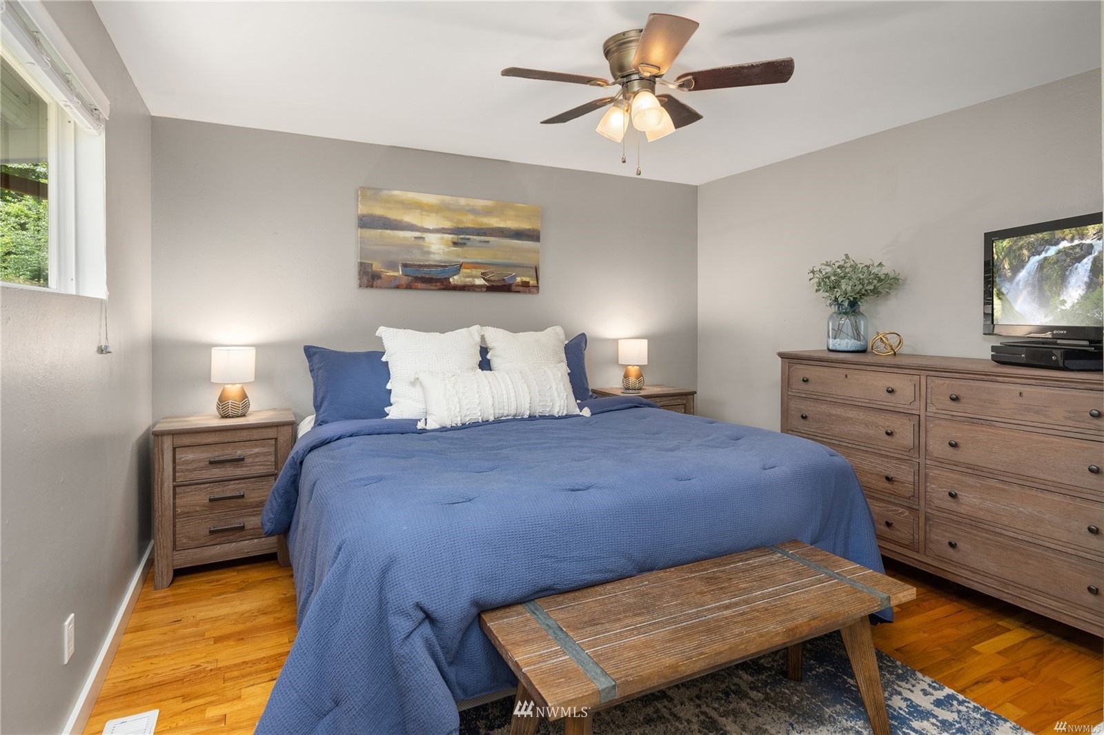 17853 Southeast 146th Street Renton, WA 98059 - Photo 14 of 26 a bedroom with a bed a dresser and a potted plant