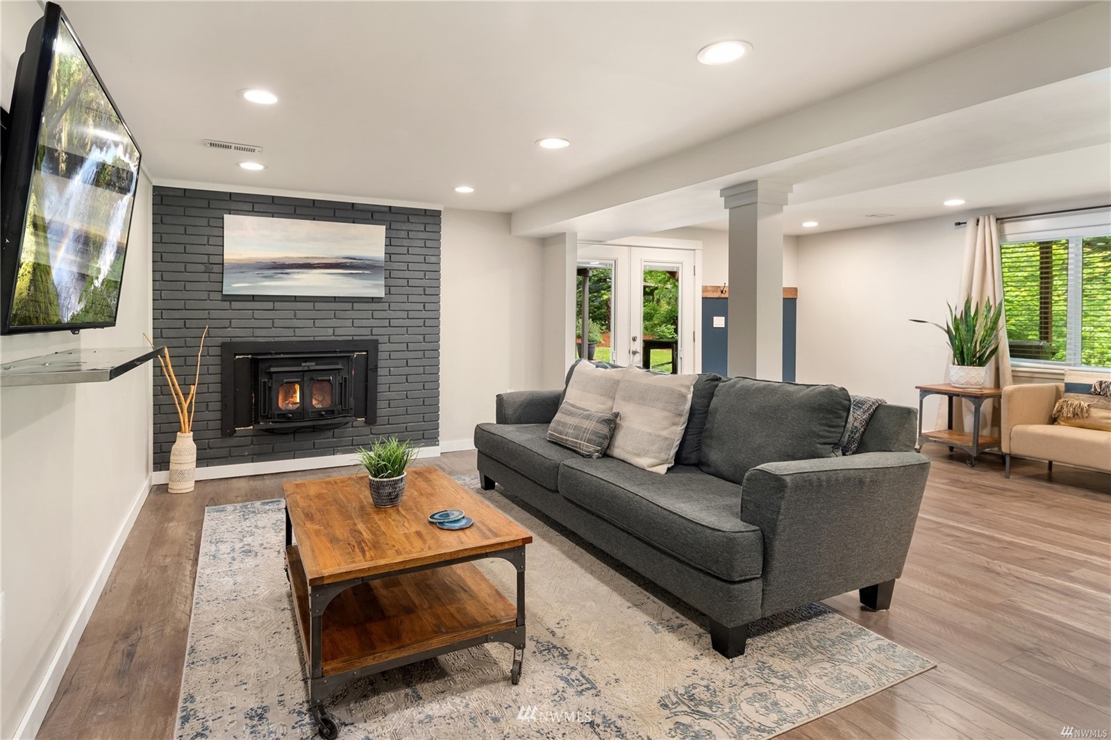 17853 Southeast 146th Street Renton, WA 98059 - Photo 15 of 26 a living room with furniture and a fireplace
