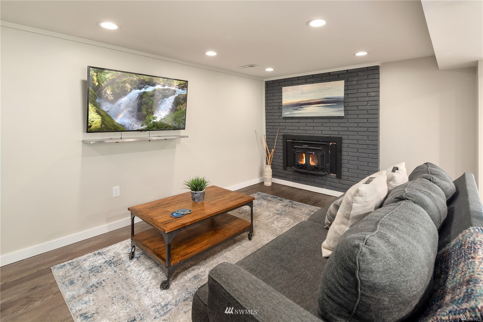 17853 Southeast 146th Street Renton, WA 98059 - Photo 16 of 26 a living room with furniture and a fireplace