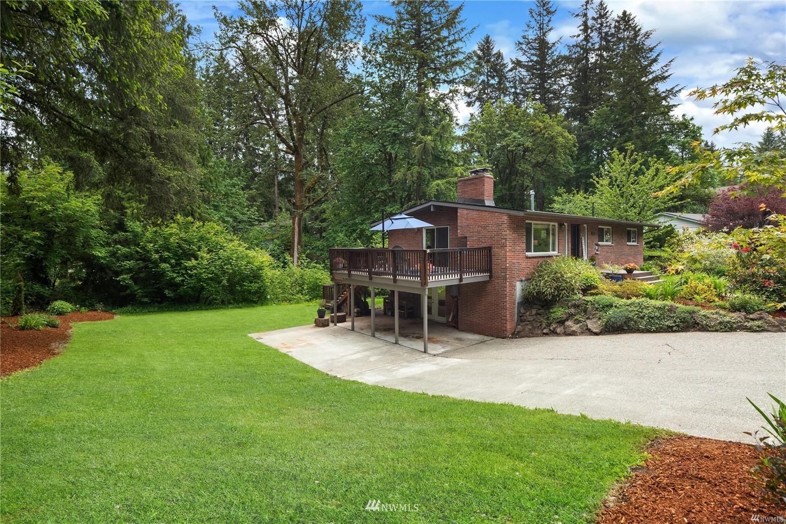 17853 Southeast 146th Street Renton, WA 98059 - Photo 24 of 26 a view of a house with a patio and a yard