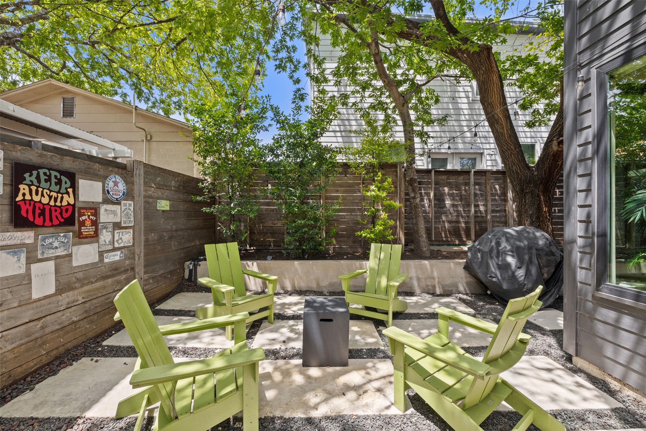 2202 Santa Rita Street Austin, TX 78702 - Photo 14 of 40 Private backyard with seating area, fire pit, and backyard deck
