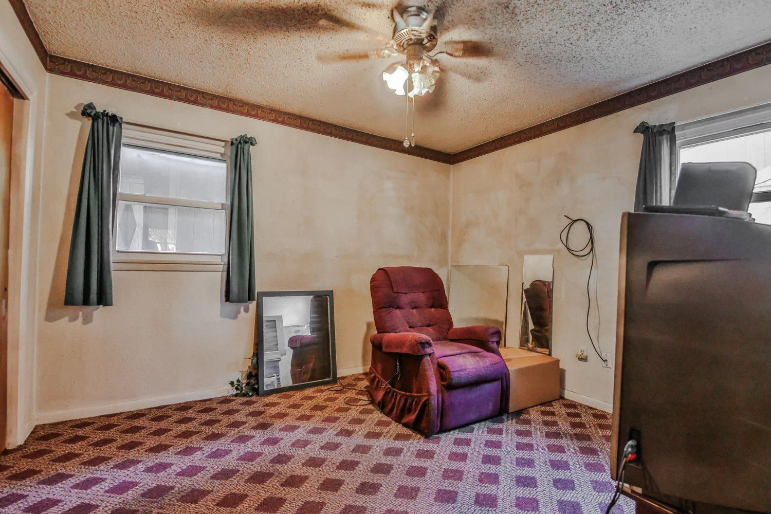 2824 63rd Street Lubbock, TX 79413 - Photo 14 of 24 a bedroom with furniture and a window