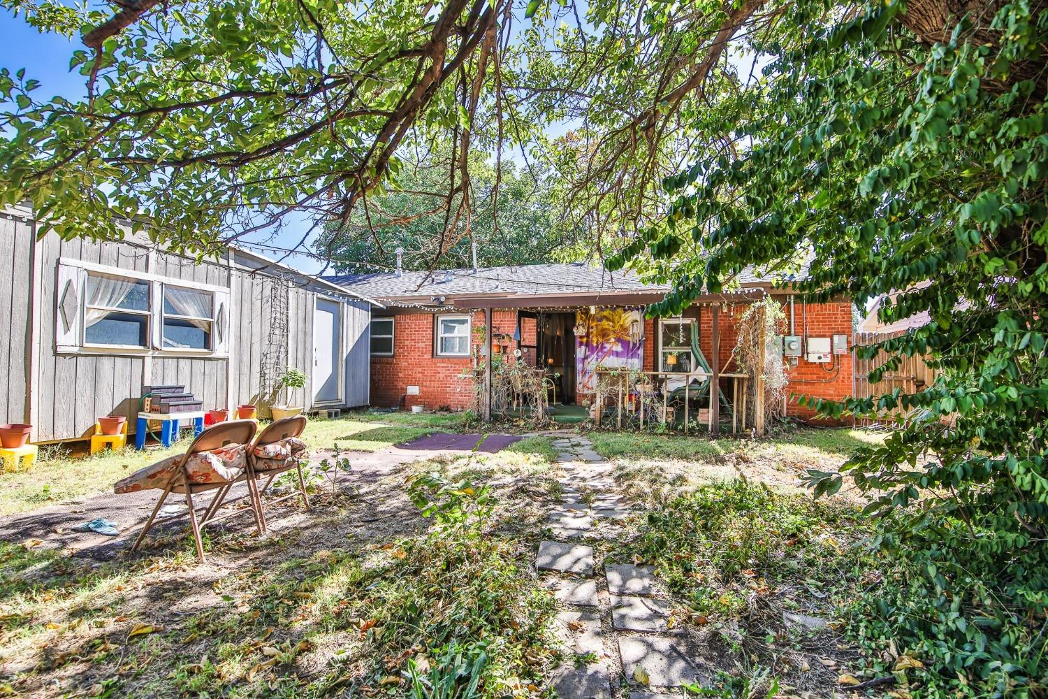 2824 63rd Street Lubbock, TX 79413 - Photo 20 of 24 a view of a house with a yard