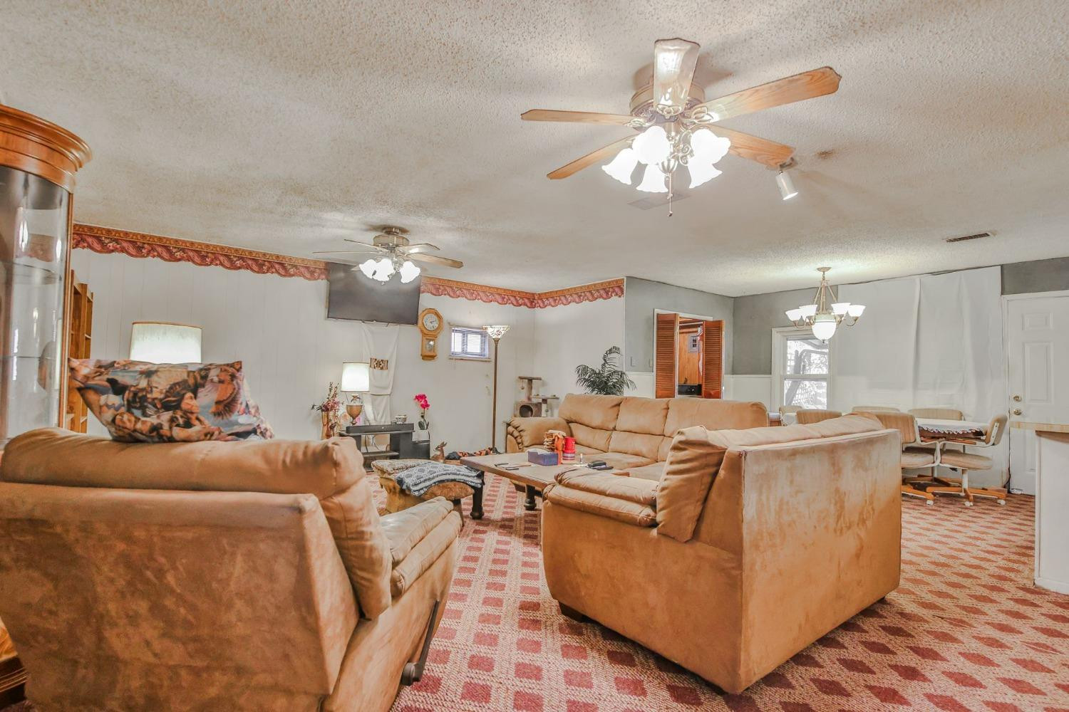 2824 63rd Street Lubbock, TX 79413 - Photo 2 of 24 a living room with furniture kitchen and a chandelier