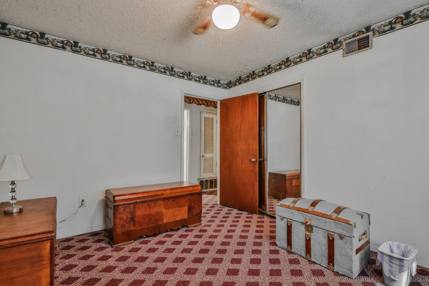 2824 63rd Street Lubbock, TX 79413 - Photo 22 of 24 a bedroom with a bed and a window