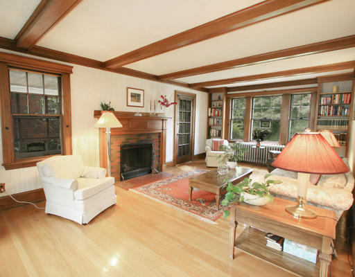 32 Llewellyn Road Newton, MA 02465 - Photo 4 of 5 a living room with furniture a flat screen tv and a fireplace