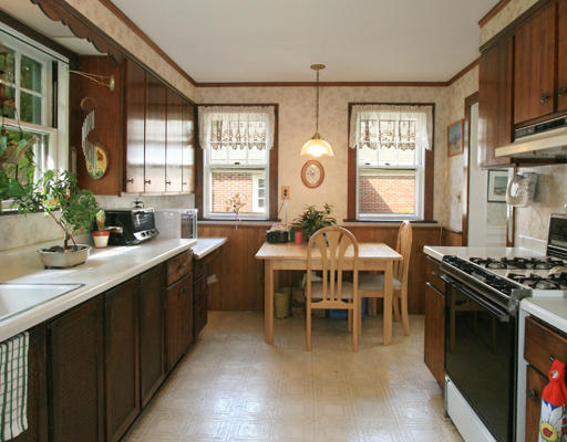 32 Llewellyn Road Newton, MA 02465 - Photo 5 of 5 a kitchen with stainless steel appliances a stove a sink a dining table and chairs