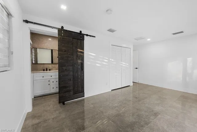 a bathroom with a sink toilet a mirror and shower