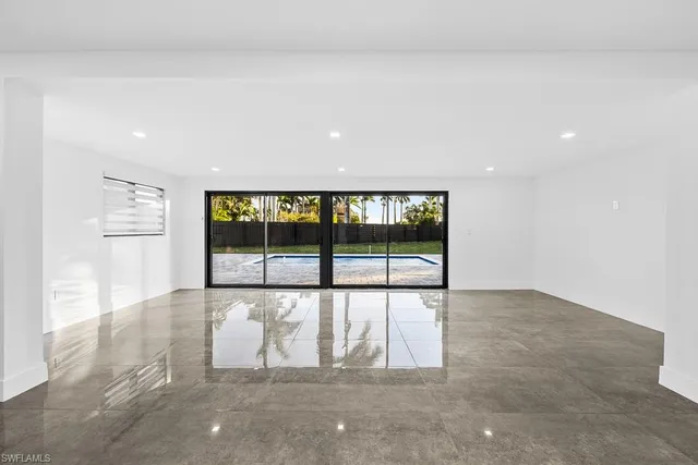 a view of kitchen with refrigerator sink and microwave