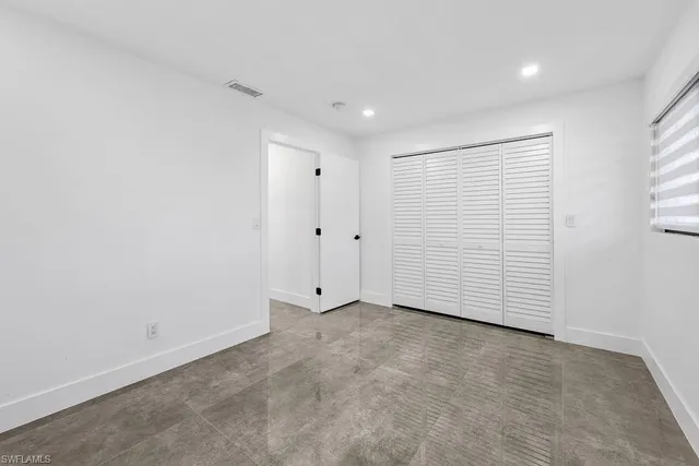 a bathroom with a double vanity sink toilet and shower