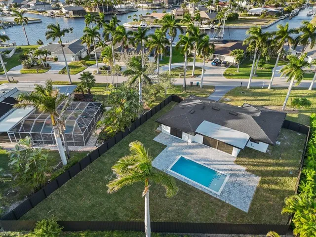a view of yard with seating area and trees around