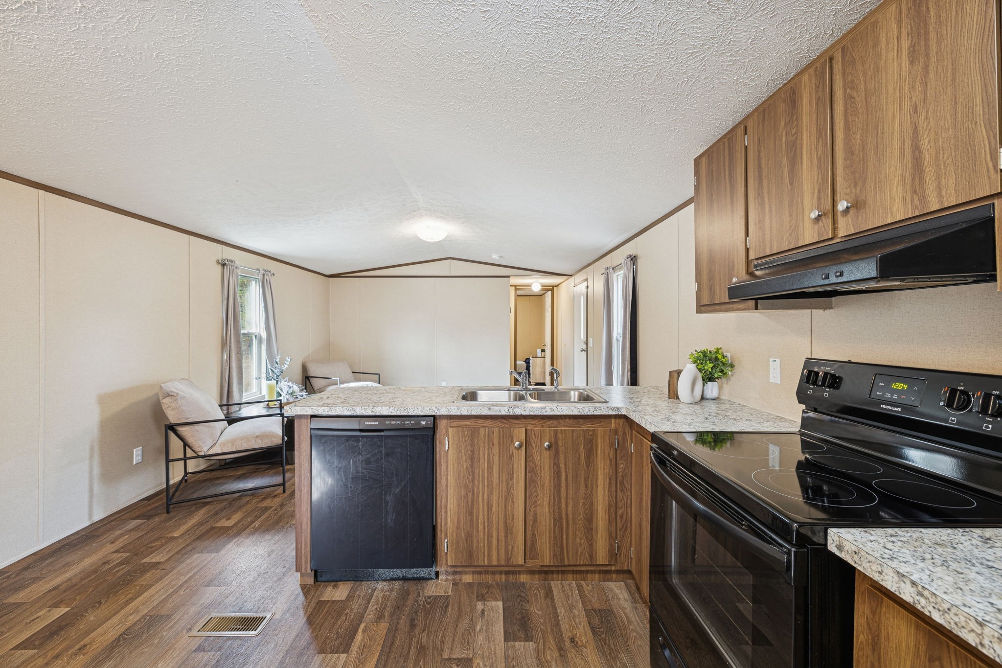 108 Lyell Road Hohenwald, TN 38462 - Photo 8 of 28 a kitchen with a sink and cabinets