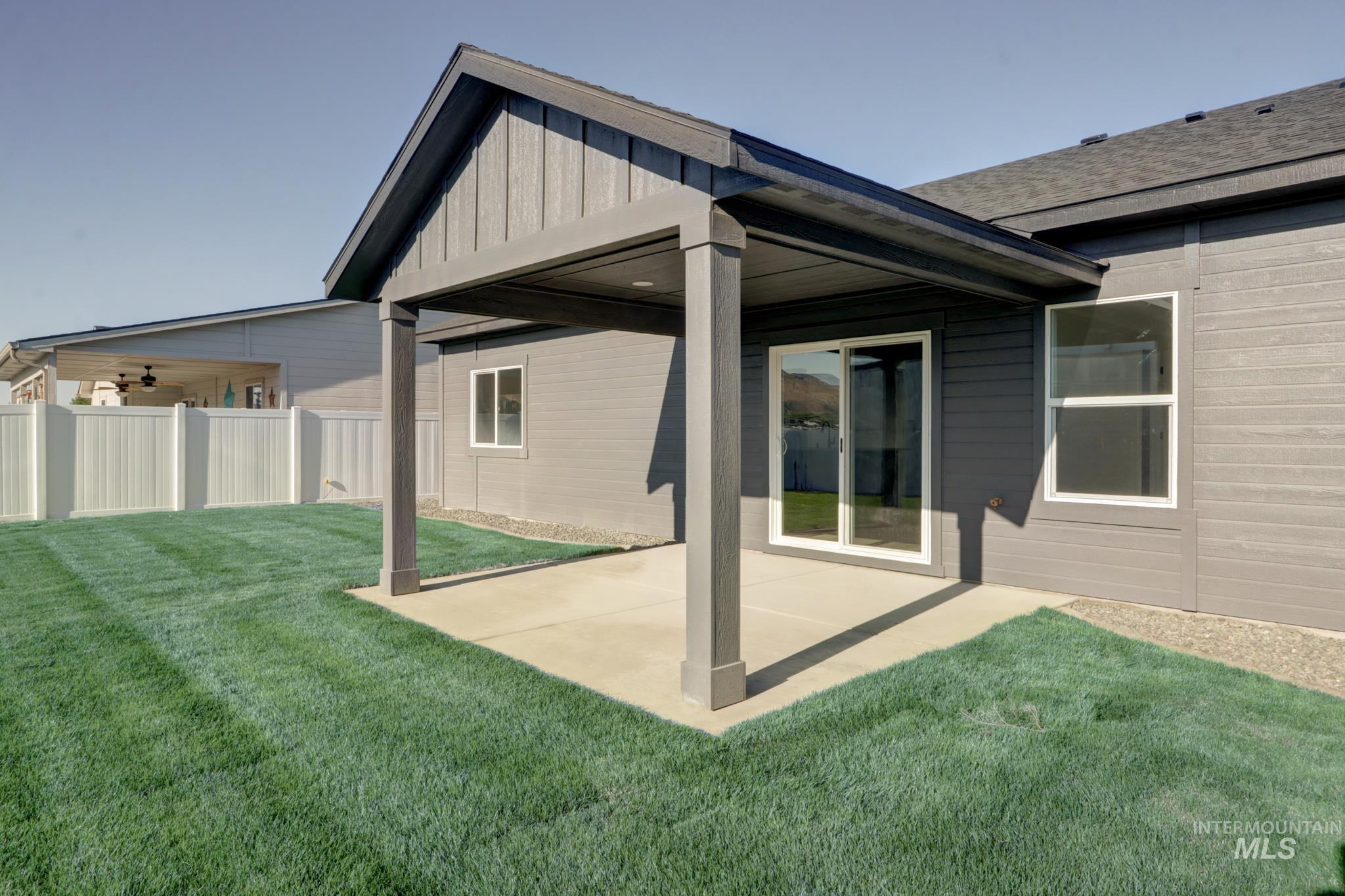 848 North 5th Street Nyssa, OR 97913 - Photo 45 of 49 Covered patio with concrete flooring, sliding glass door entry, and two windows