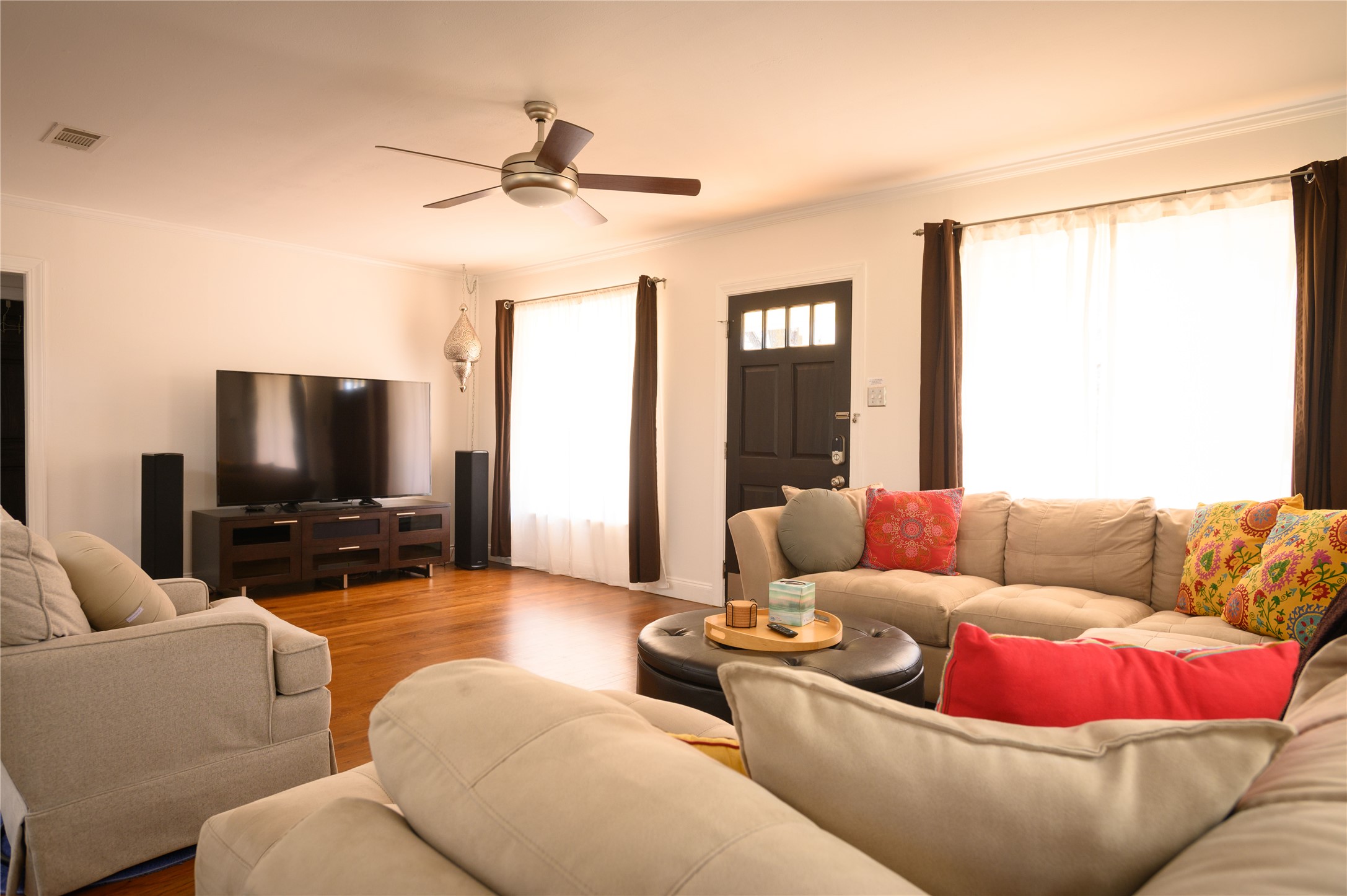 4902 Pecan Springs Road Austin, TX 78723 - Photo 18 of 40 a living room with furniture and a flat screen tv