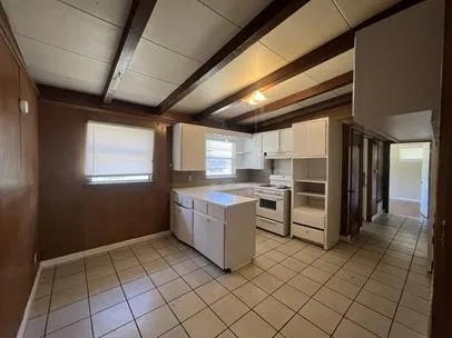 a kitchen with a cabinets and window