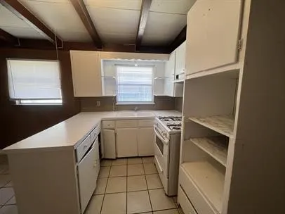 a utility room with washer and dryer
