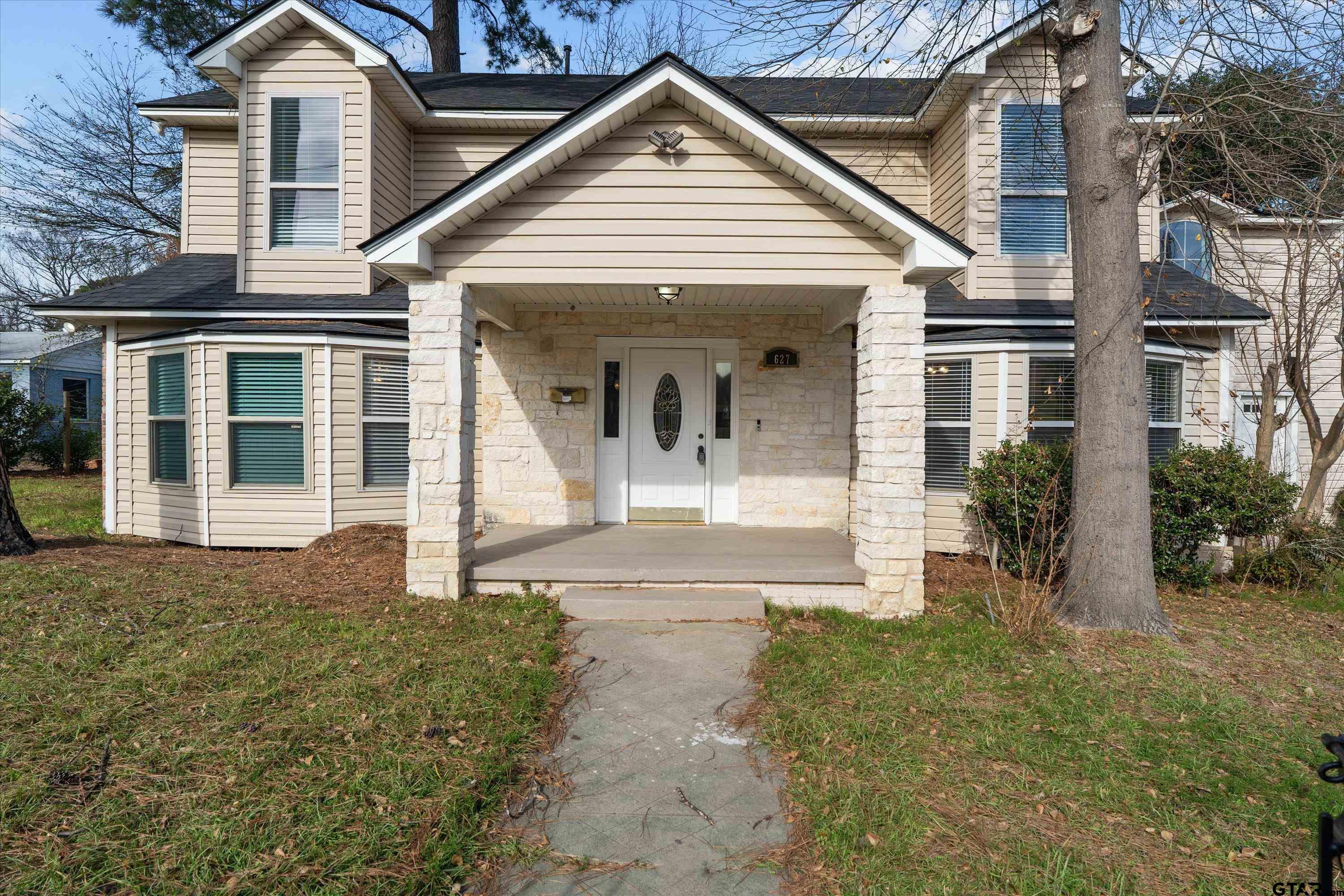 front view of a house with a yard