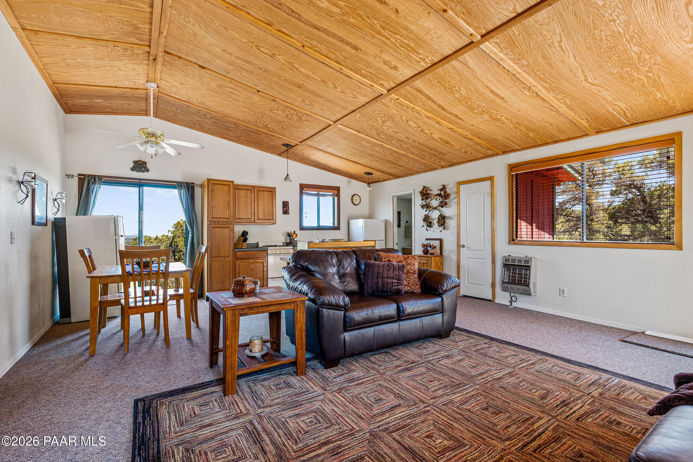 33749 West Whiskey River Road, Unit 21 Seligman, AZ 86337 - Photo 11 of 41 a living room with furniture a wooden floor and next to a window