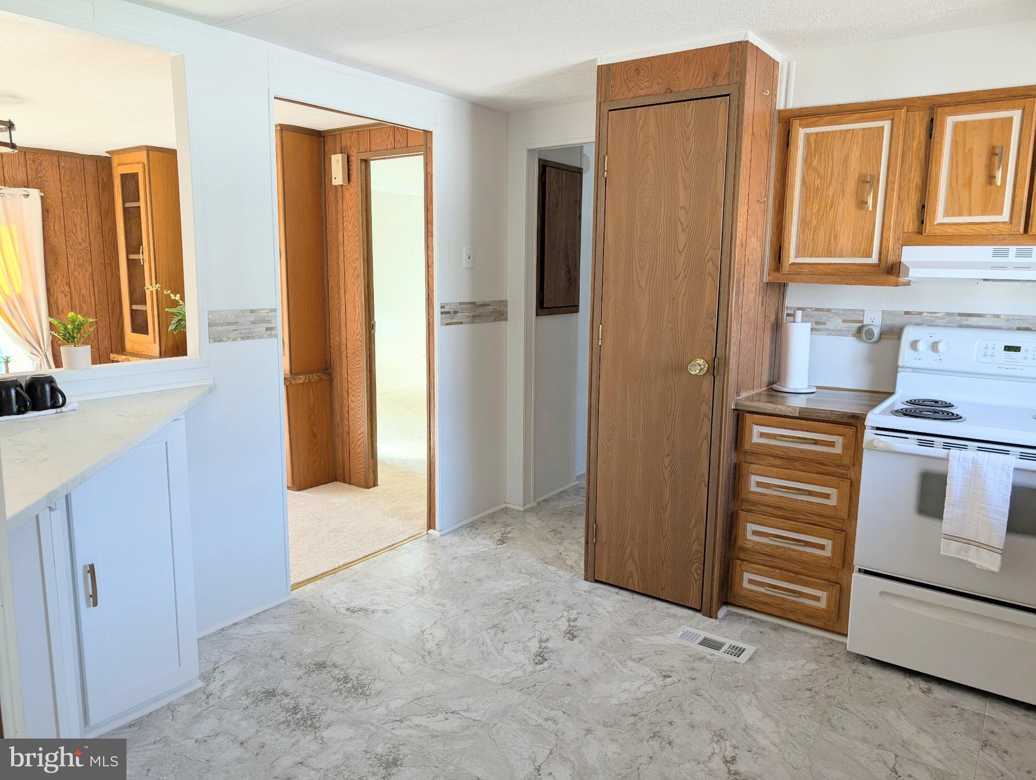 3 Park Lane Easton, MD 21601 - Photo 15 of 34 a view of kitchen with stainless steel appliances granite countertop cabinets and a refrigerator