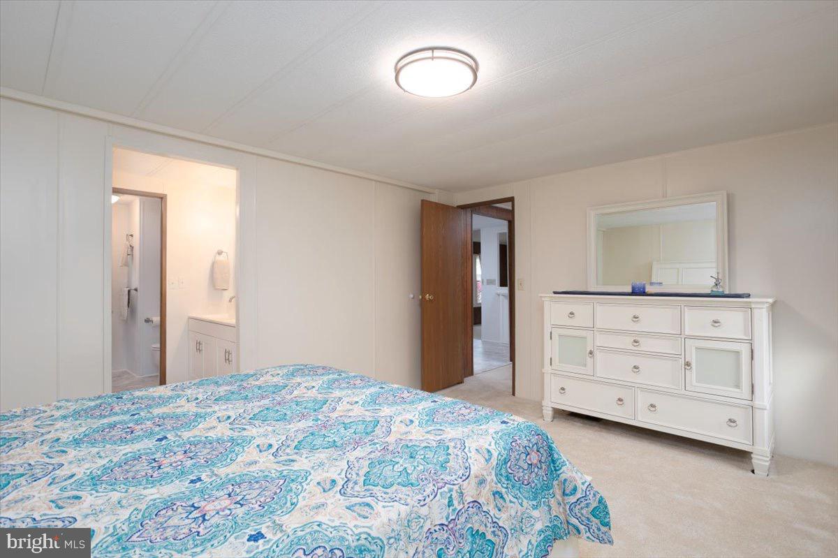 3 Park Lane Easton, MD 21601 - Photo 19 of 34 a bedroom with a bed and a dresser in it